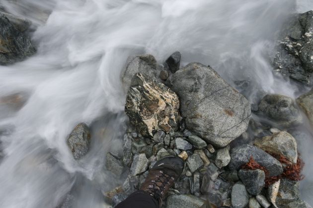 river flowing around a stone