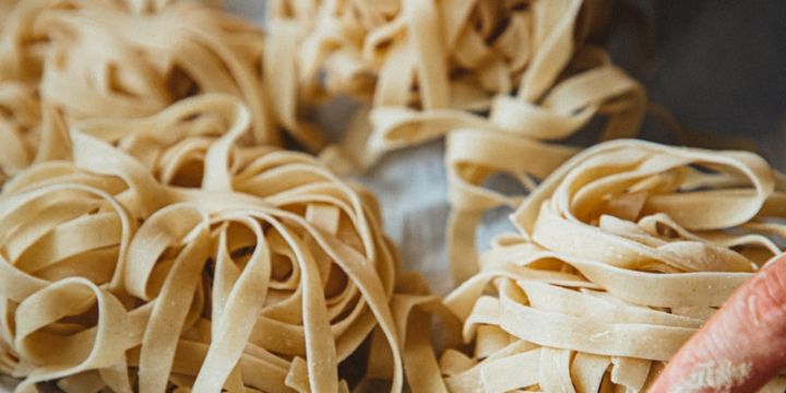 person holding brown wooden stick